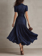 Raquel · Vestido midi satinado azul de rayas